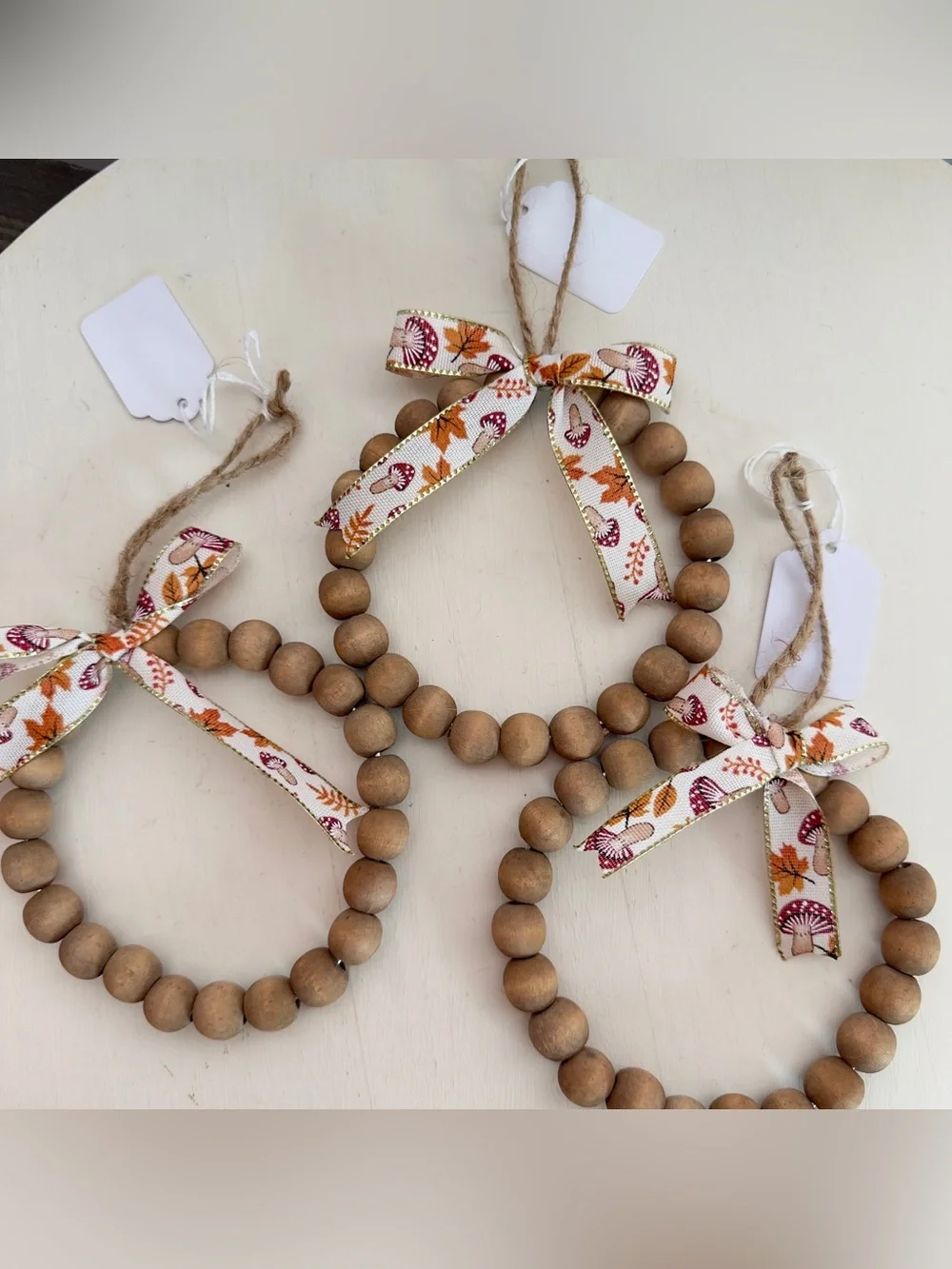 3 Handmade Wood Beaded Wreath Ornament With Mushroom Print Bow